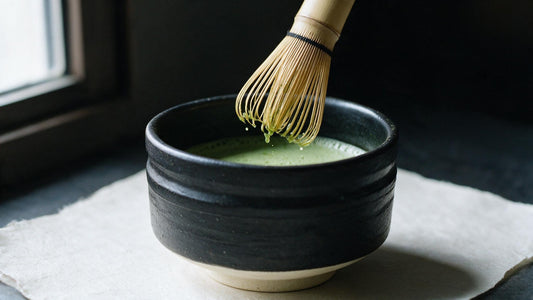 A chasen lifted dripping from the bowl, the foam finished and even