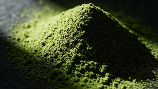 Macro view of bright green matcha powder, finely ground, lit from the side