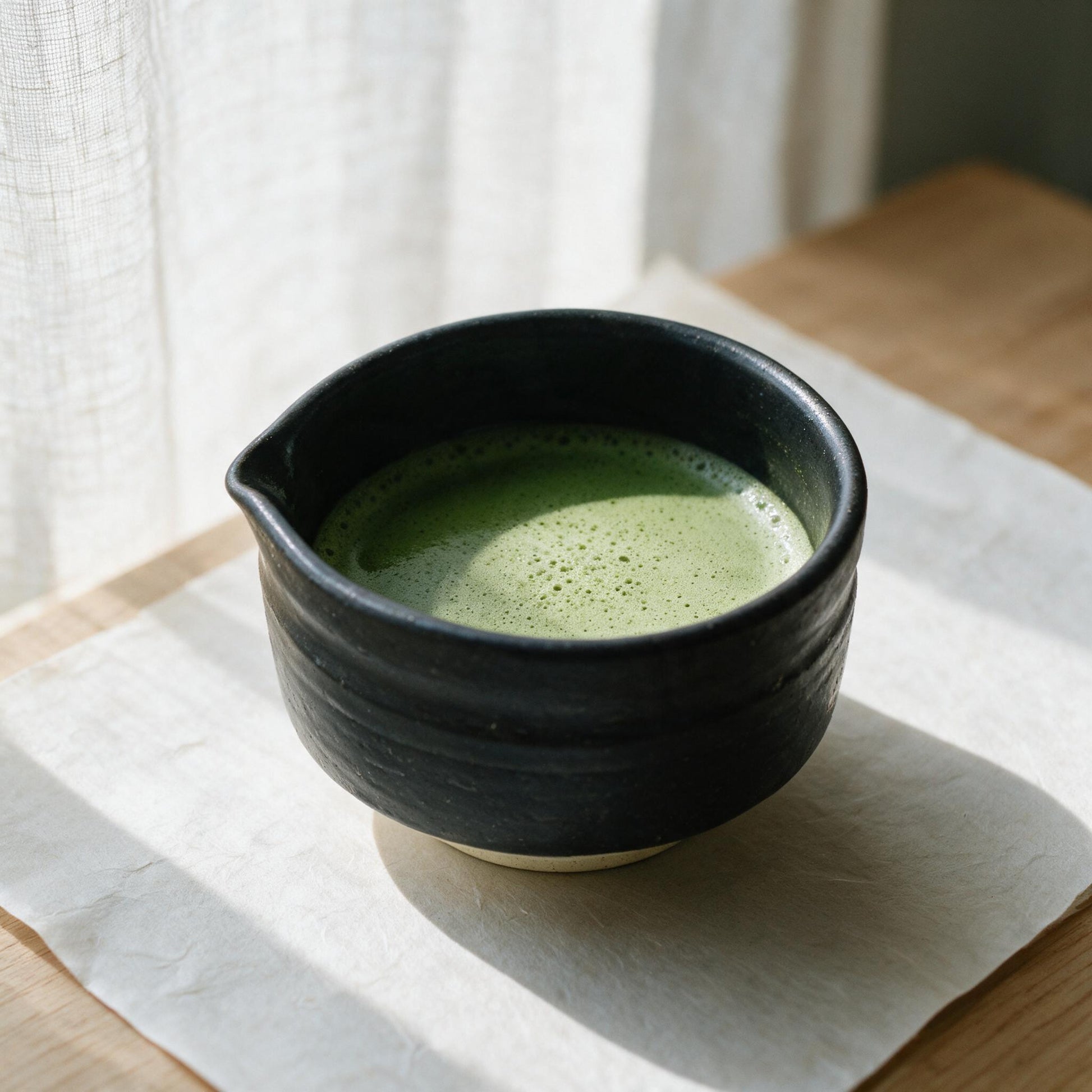 Mino-yaki chawan with matcha, by a window