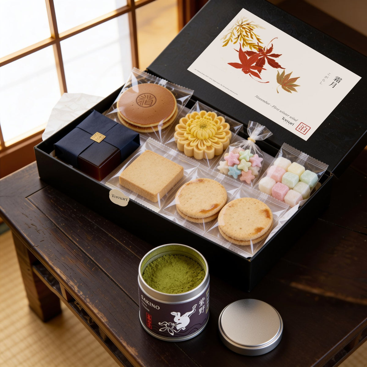 An example of an opened Matcha & Wagashi Box: seasonal Japanese sweets beside an open tin of matcha